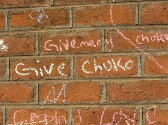 "give me chalk" written in chalk. 